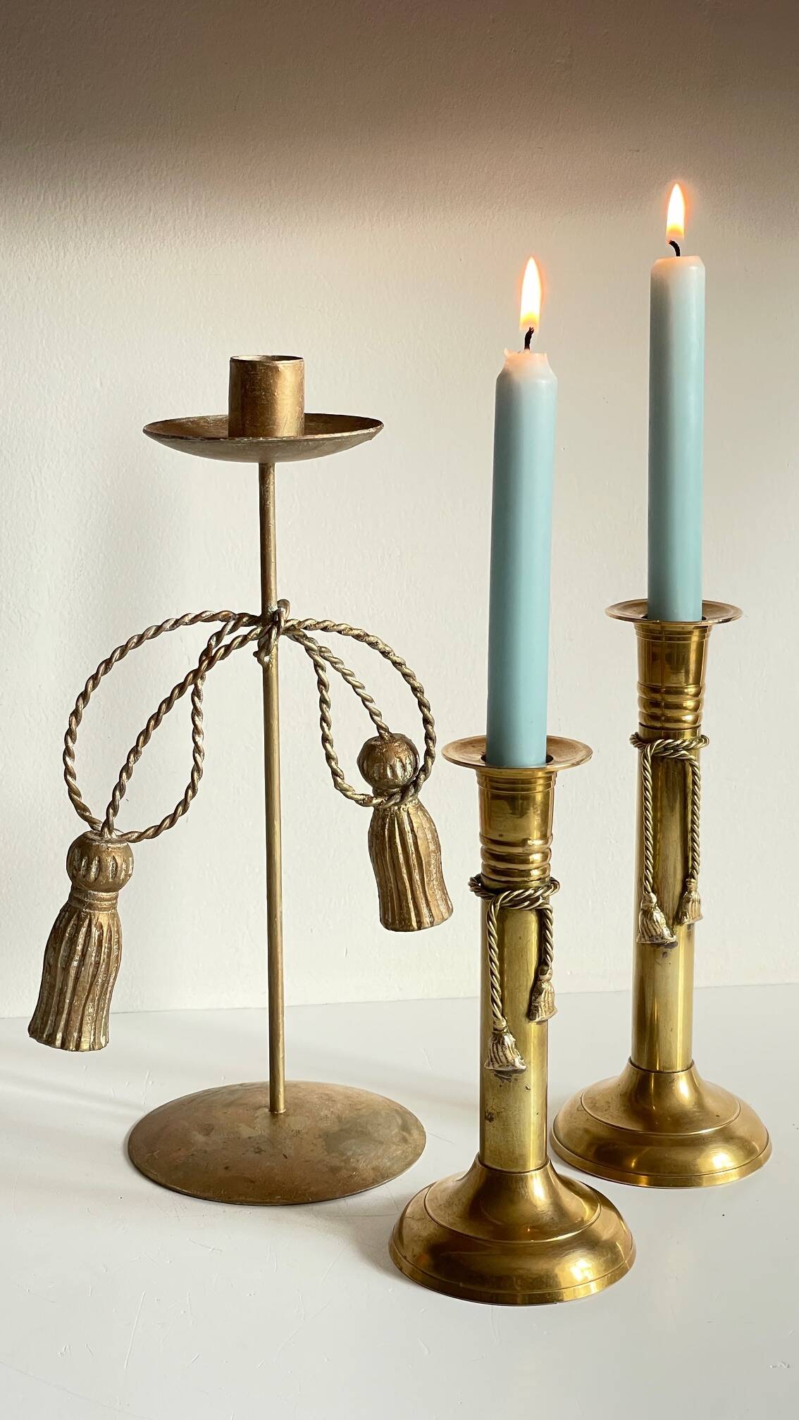 Trio of vintage knotted candlesticks brass