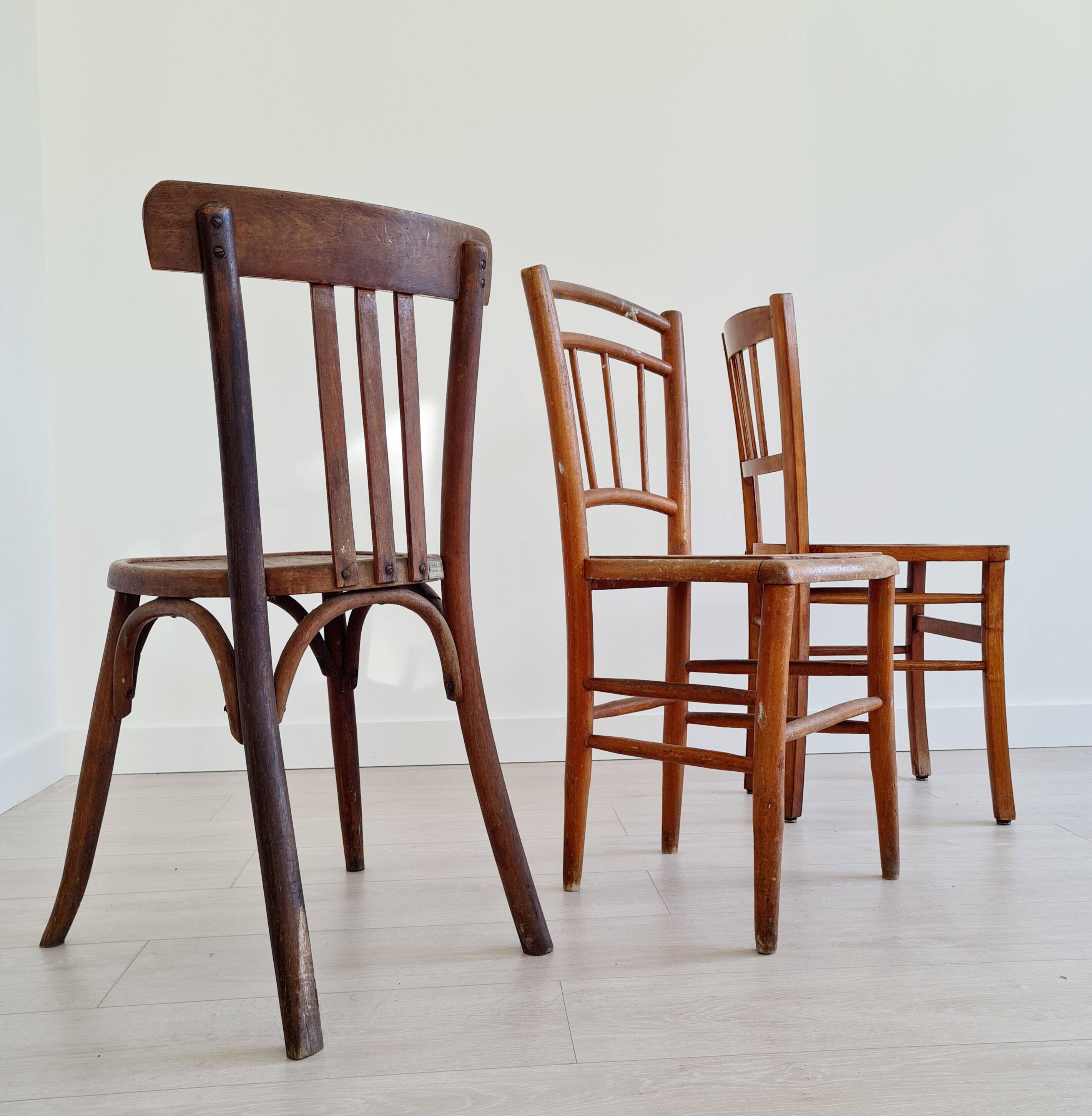 Mismatched wooden bistro chairs