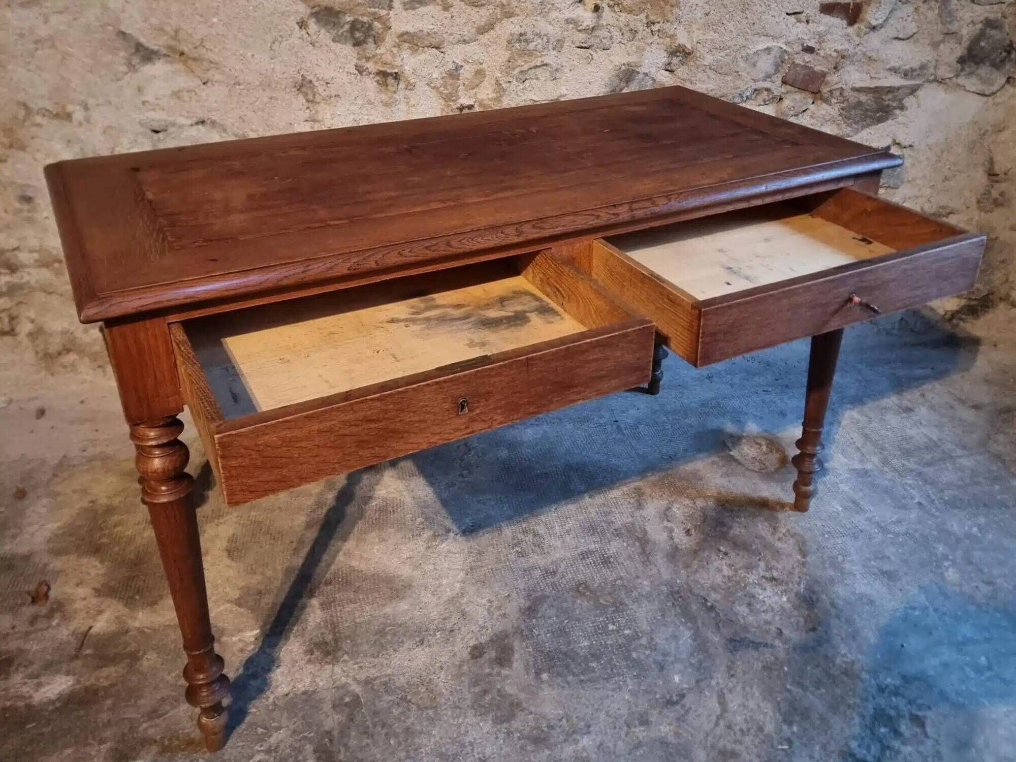 Antique French writing desk in oak with two drawers, 1920s.