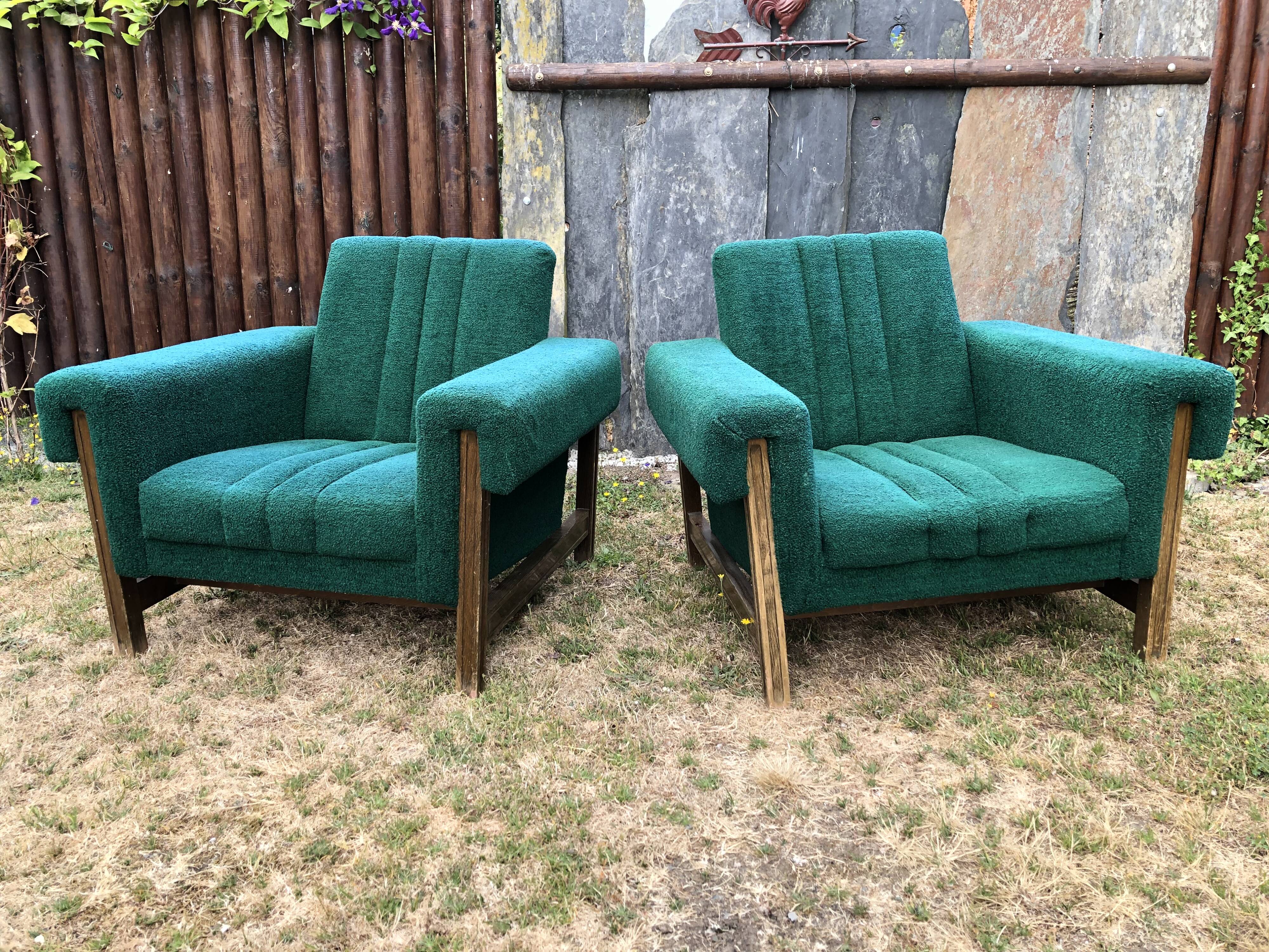 Duo of vintage armchairs with green fabrics.