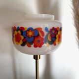 Table lamp with a vintage “flower power” glass globe and a gold base