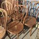 Six patinated bistro chairs