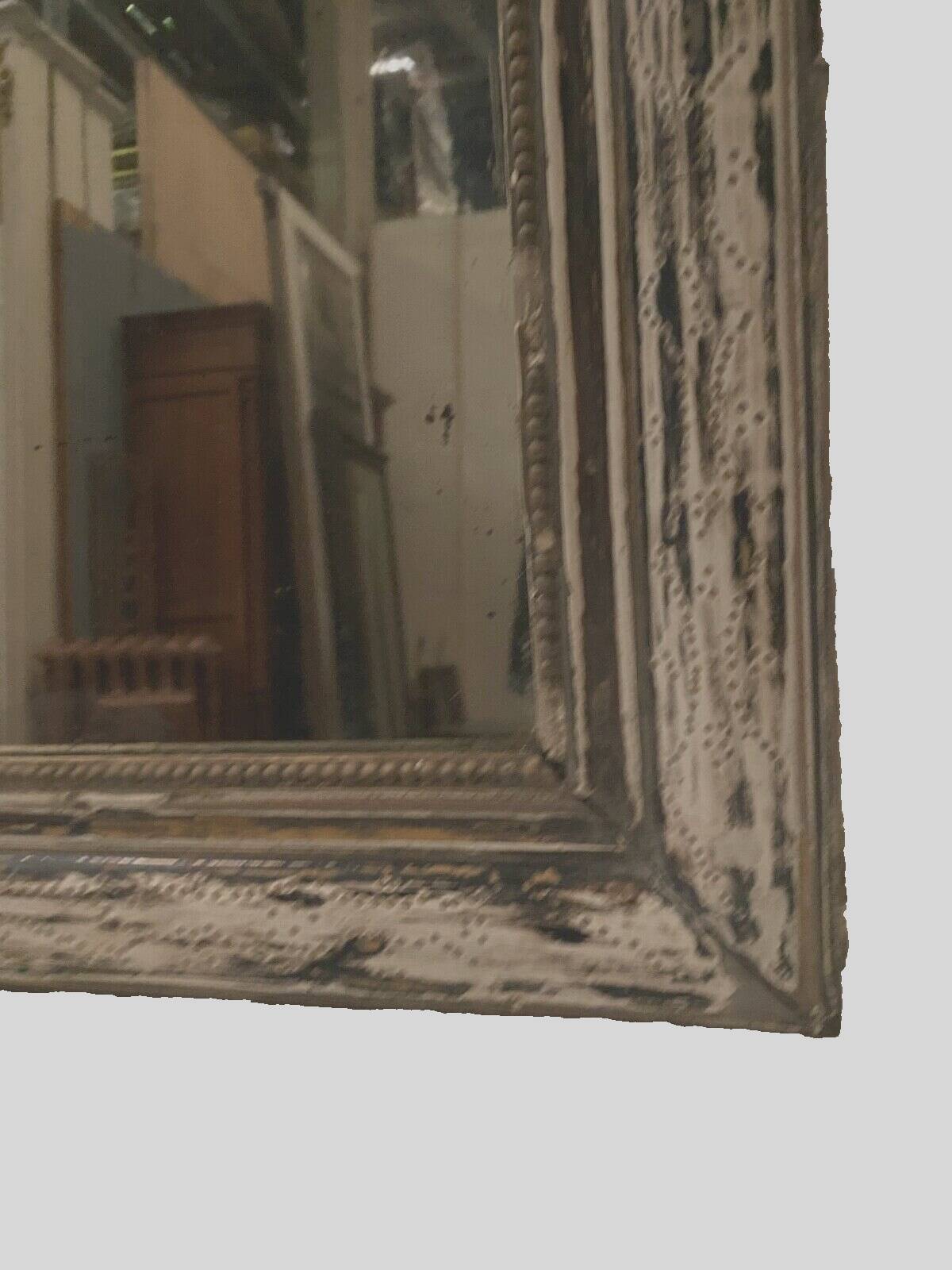 Louis Philippe mirror in wood and patinated stucco 19th century