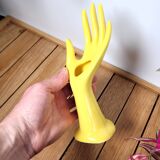 Hand wears ring and yellow soliflore