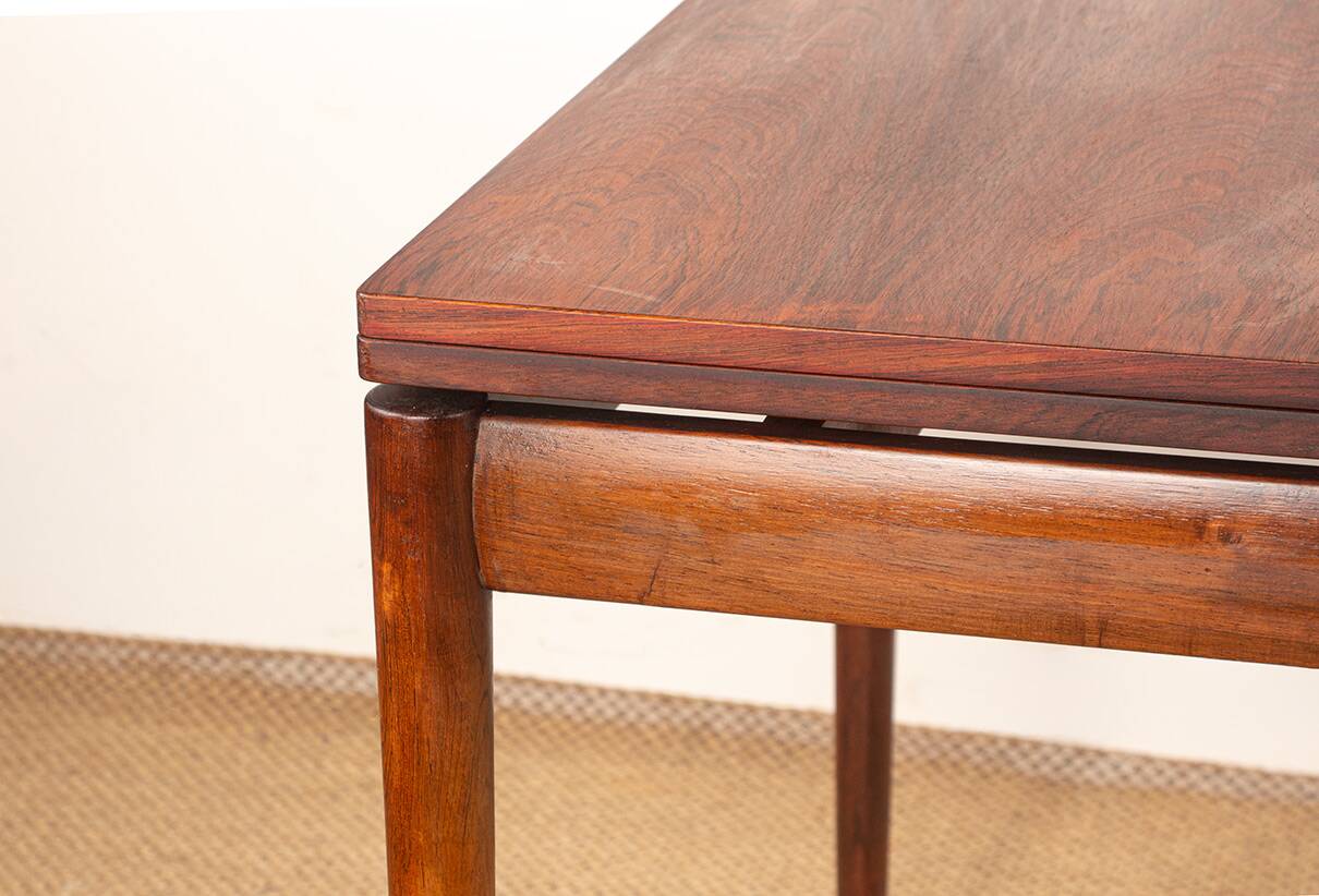 Danish extendable dining table in rosewood and brass by Poul Volther