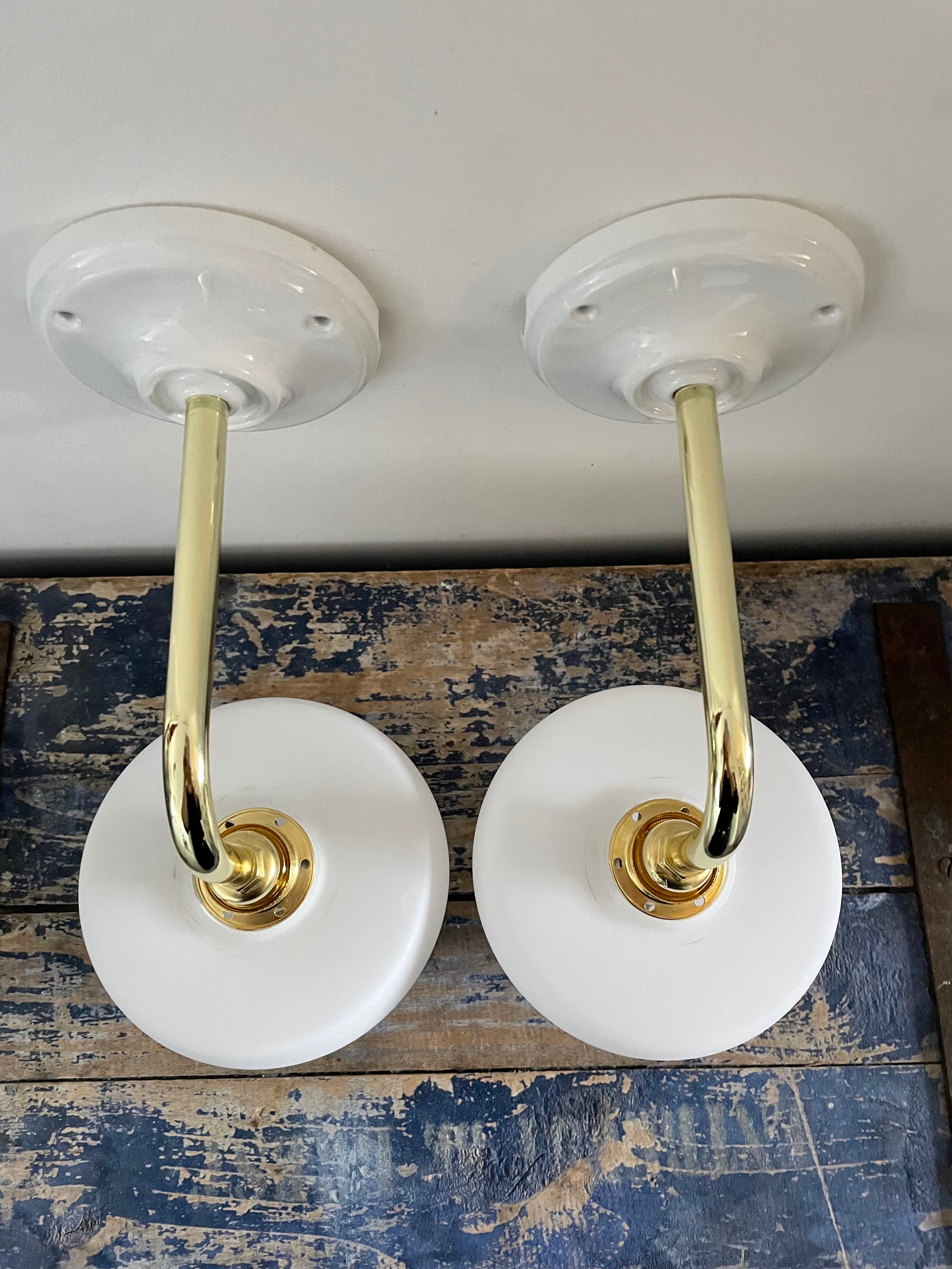Set of two electrified white opaline wall lamps to nine