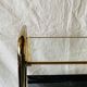 Magazine rack, saddle on vintage wheels