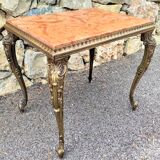 Coffee table with curved legs and pink marble top