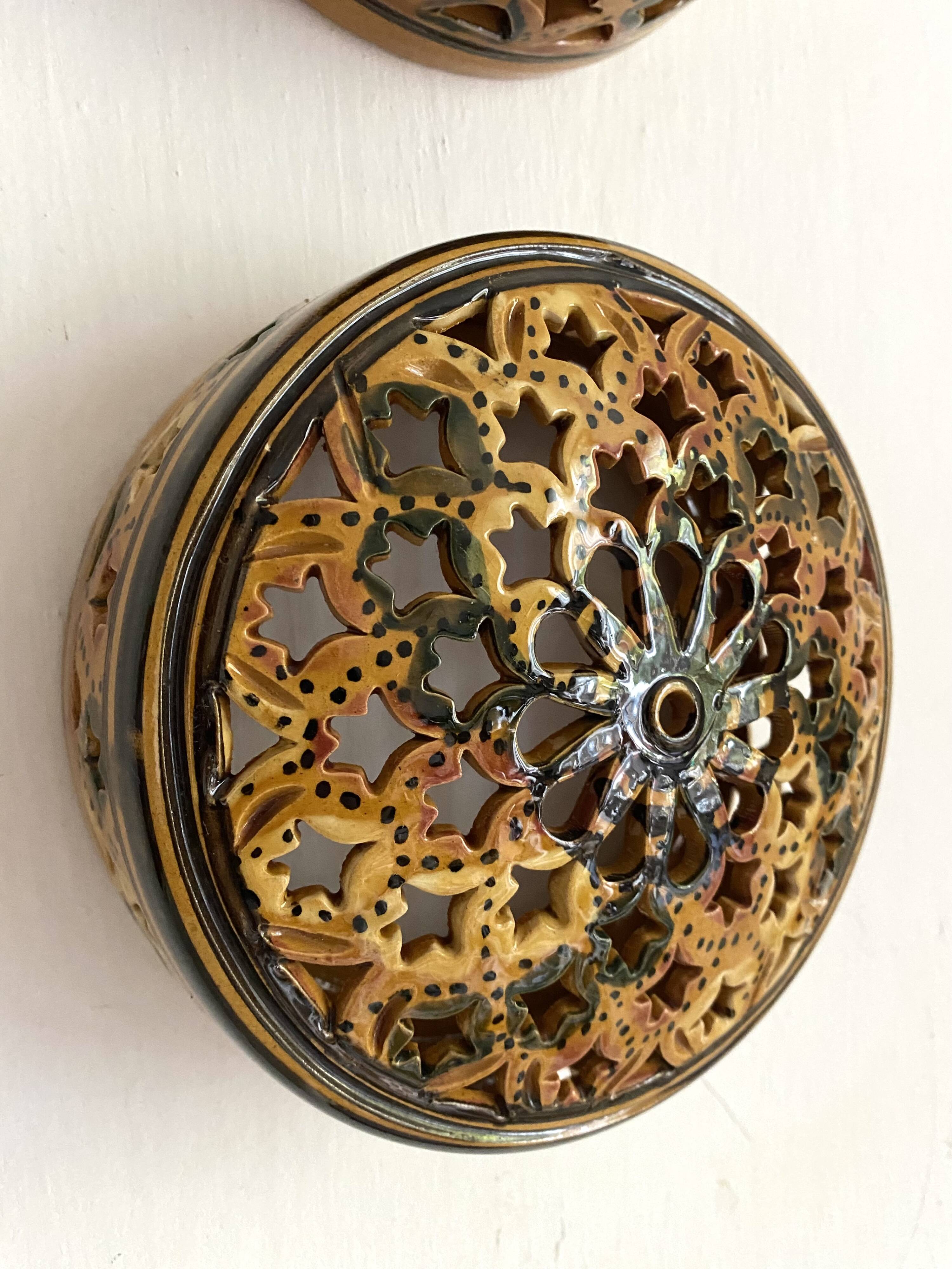 Pair of enamelled terracotta wall lights