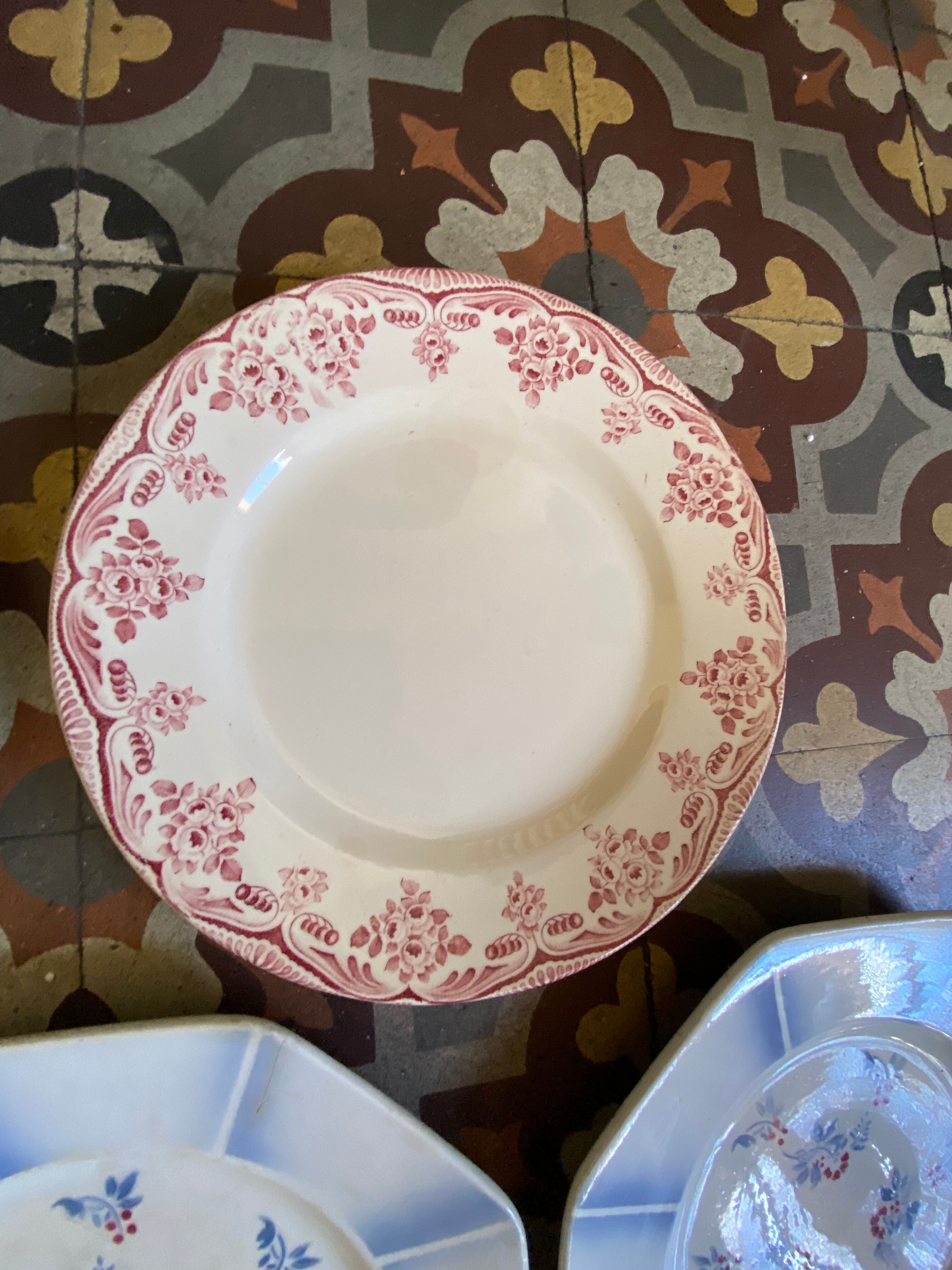 7 matching dessert plates in red green and blue.