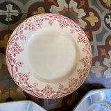 7 matching dessert plates in red green and blue.