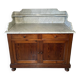 Antique wood and marble kitchen sideboard with carved backsplash