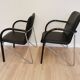 Set of 2 vintage office chairs in black leather chrome base plastic armrests / retro 1980s room