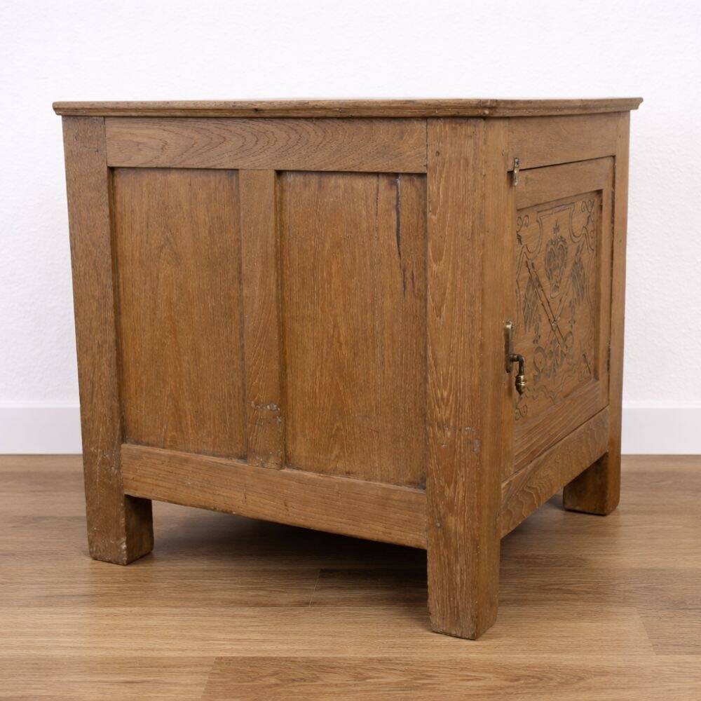 Oak side cabinet with carved motifs