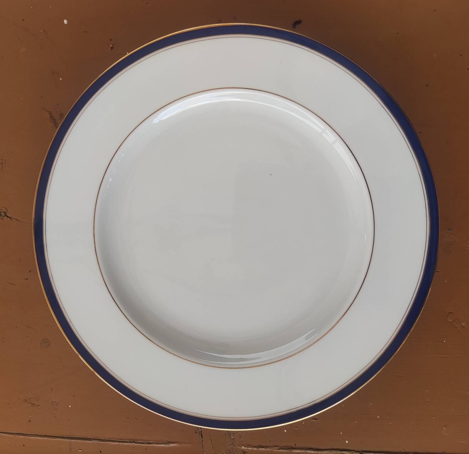 Six blue and gold Limoges porcelain dinner plates