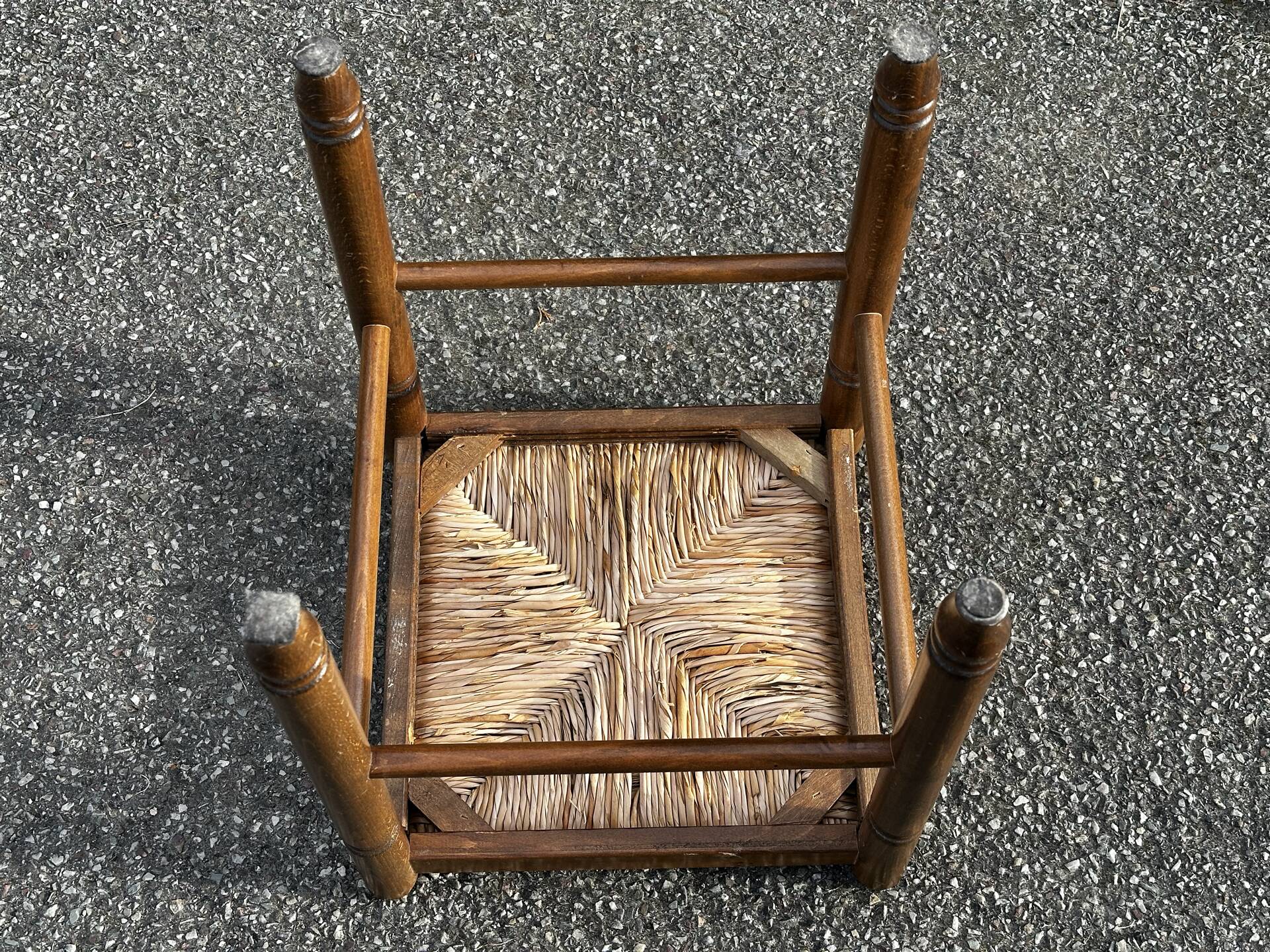 1950s turned wooden stool with a straw seat.