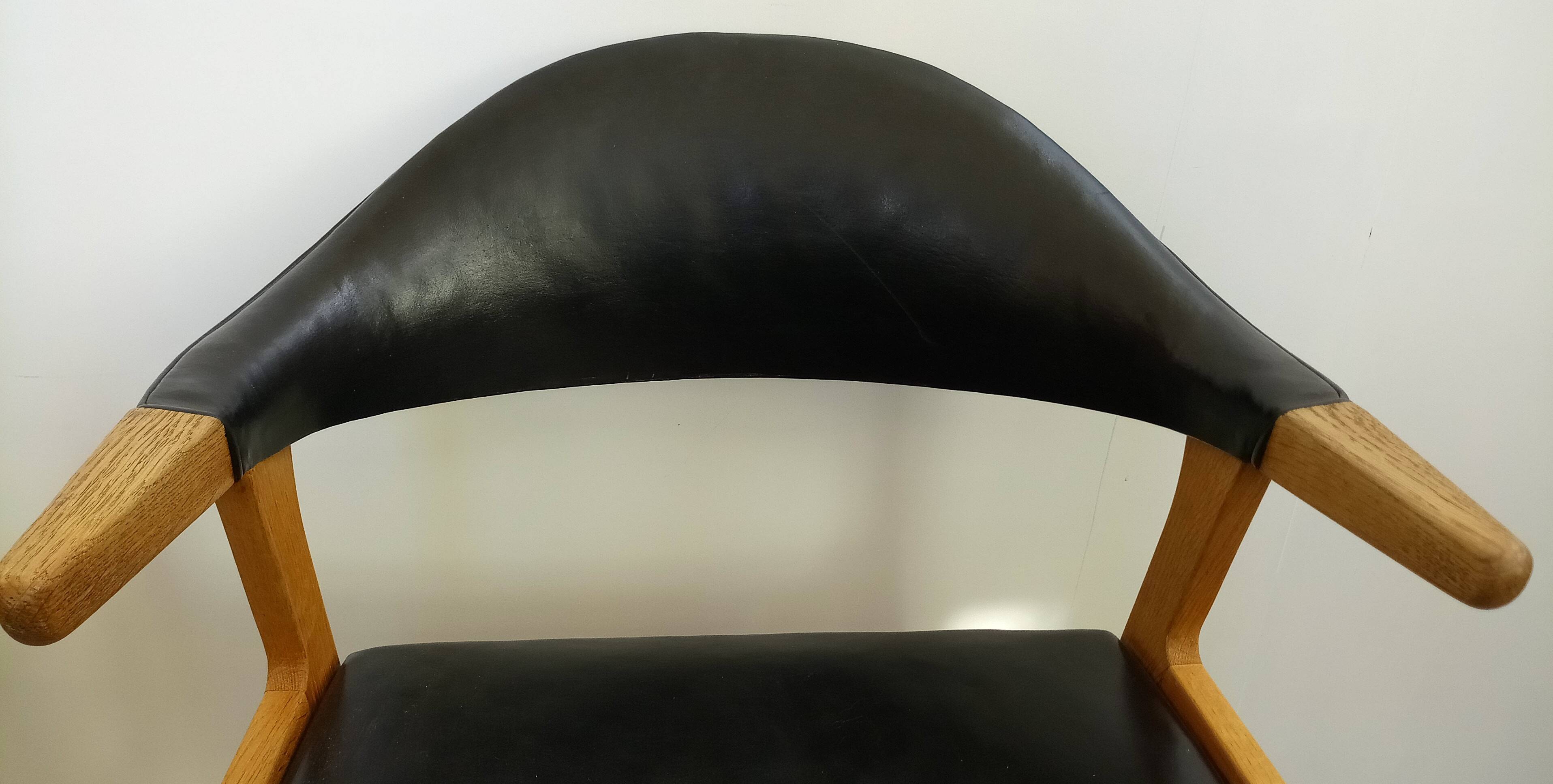 Danish armchair in oak and black leather