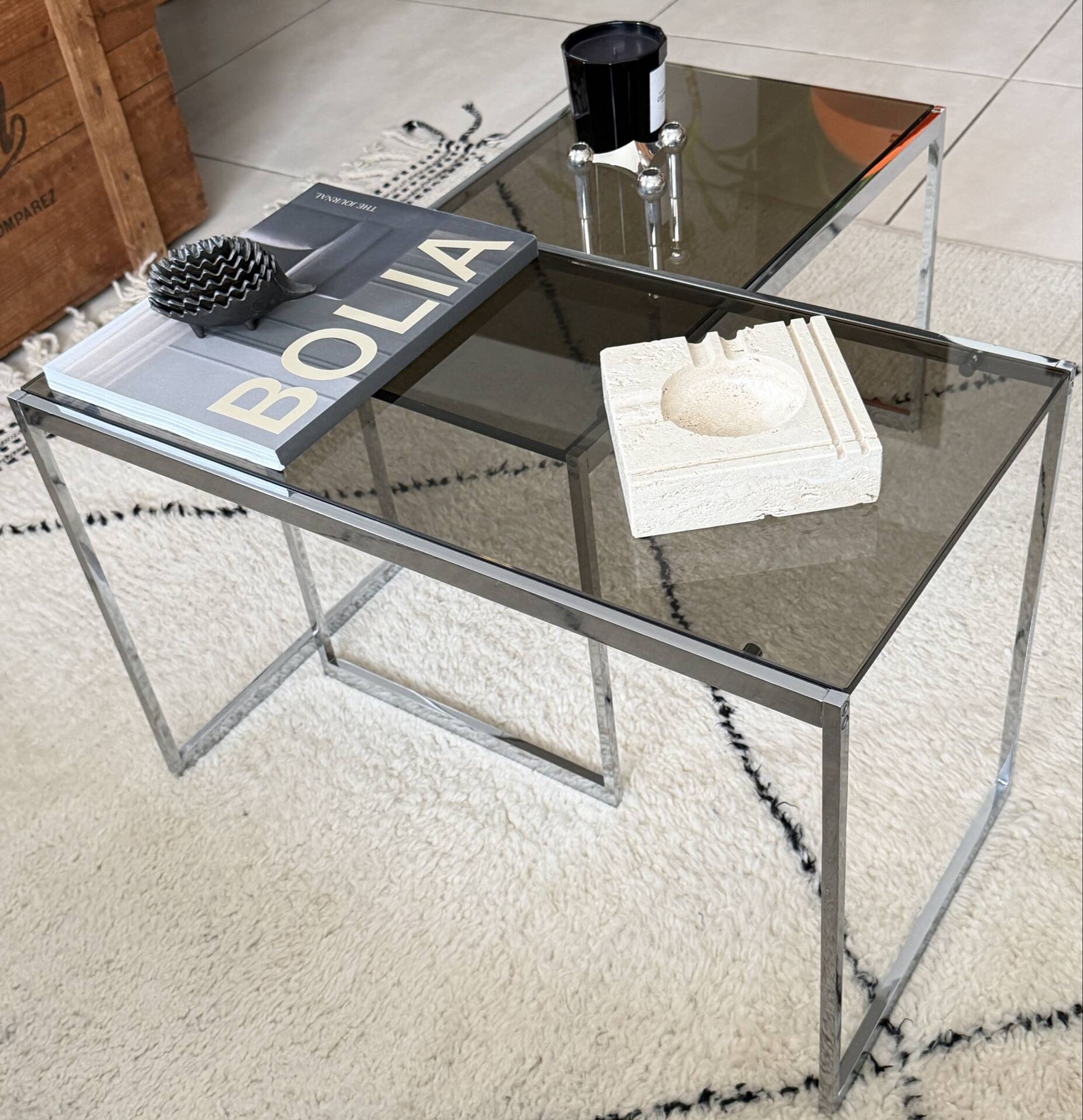 Set of 2 vintage nesting coffee tables in chrome metal and smoked glass.