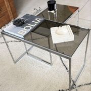 Set of 2 vintage nesting coffee tables in chrome metal and smoked glass.