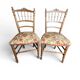 Two floral upholstered music chairs from the early 20th century.