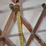 vintage wooden coat rack folds out like an accordion