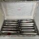 12 silver-plated metal knives