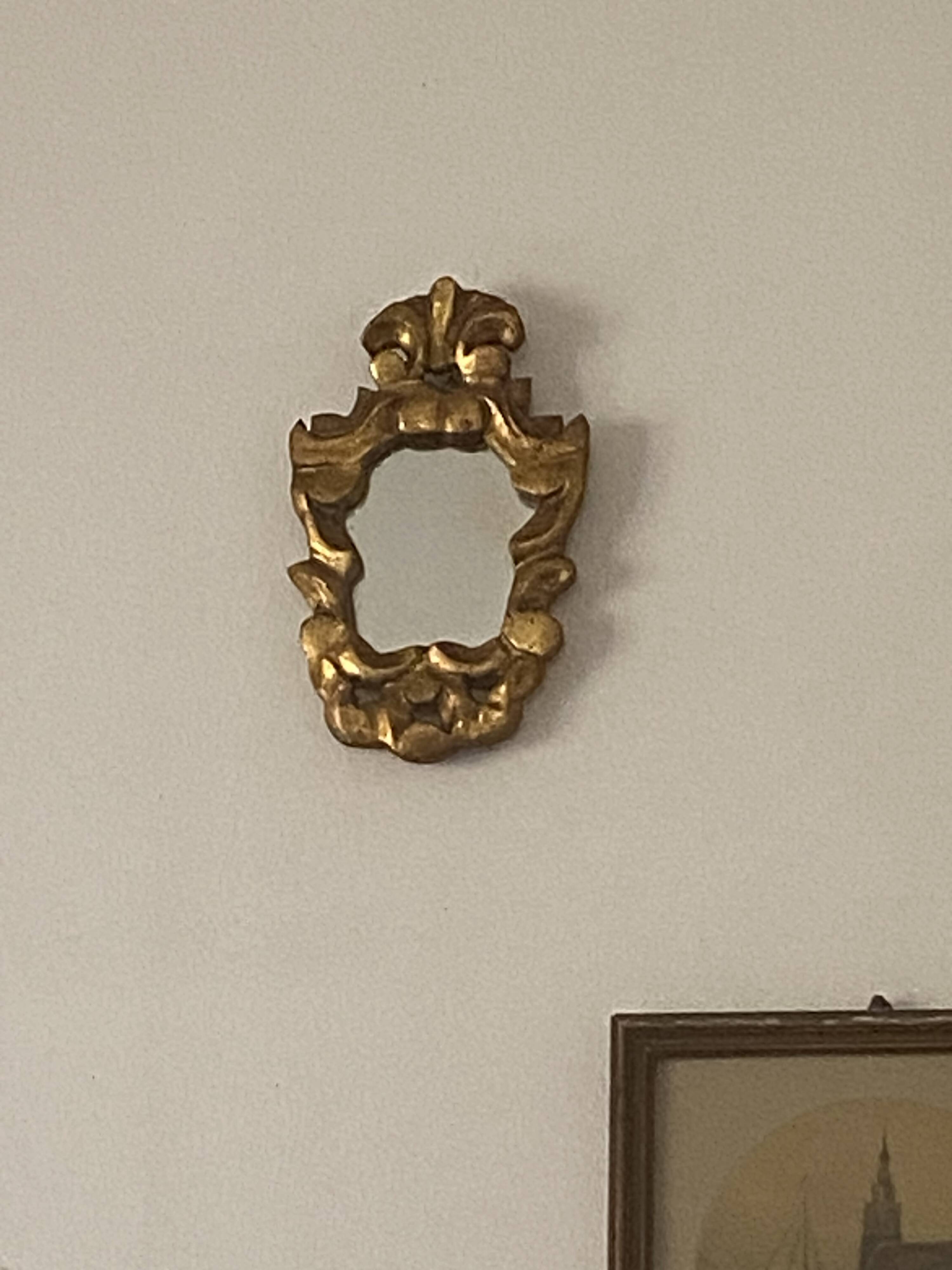 Small baroque gilded wood mirror.
