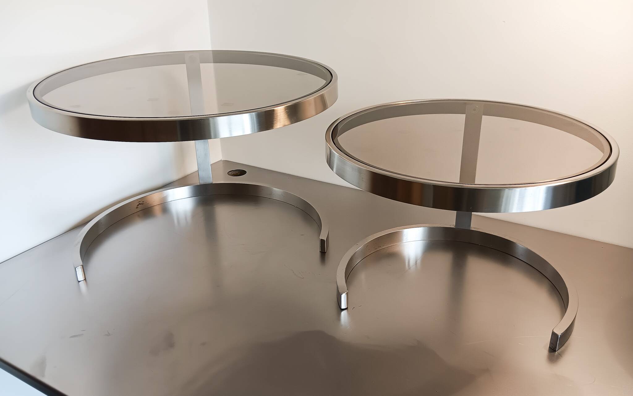2 vintage 1970s smoked glass and brushed metal nesting coffee tables