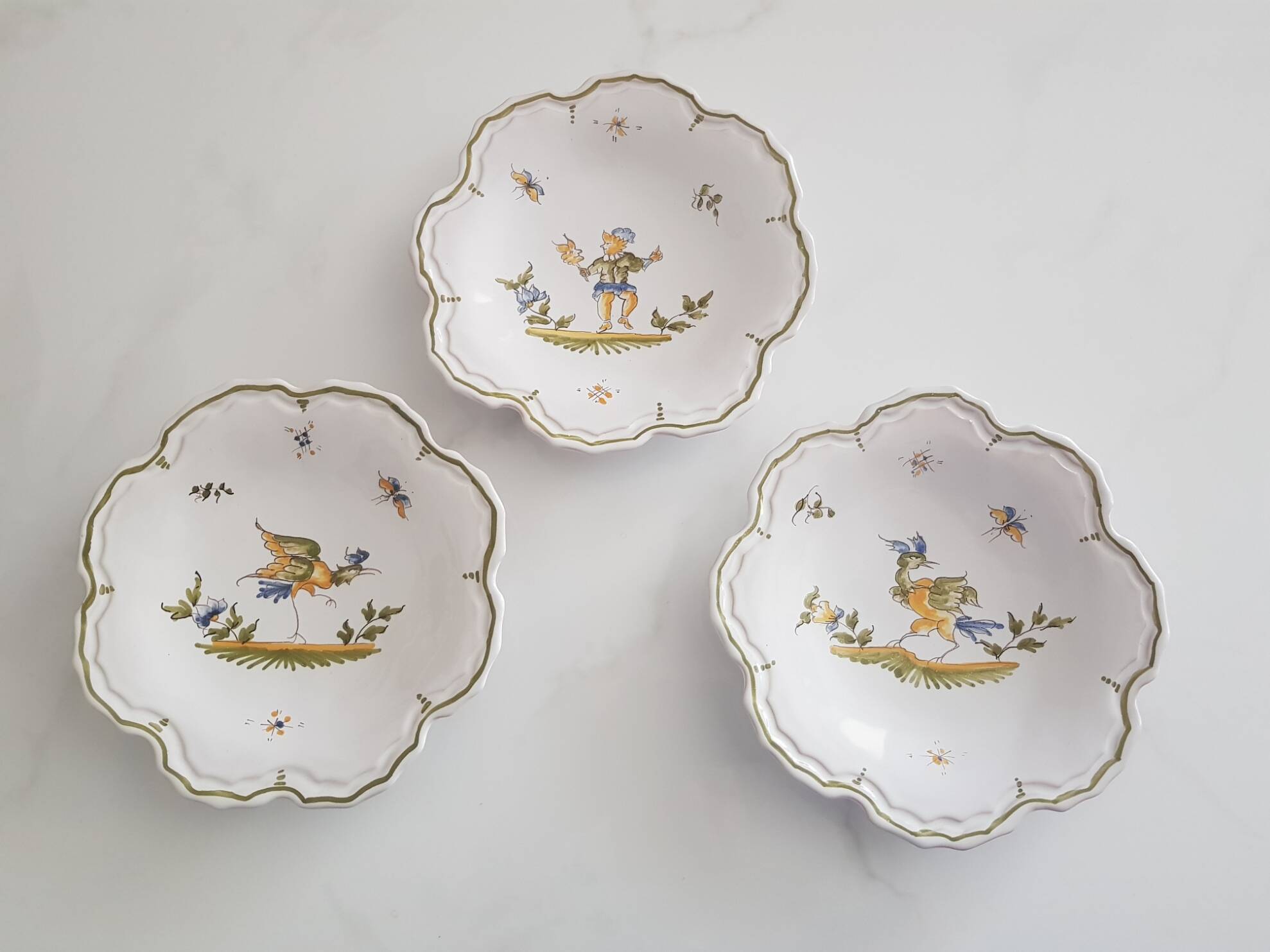 3 small signed Moustiers decorated plates with lace