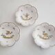 3 small signed Moustiers decorated plates with lace