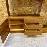 Modular wall-mounted bookcase in walnut