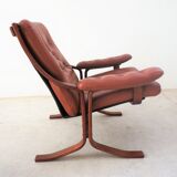Scandinavian armchair made of wood and cognac leather