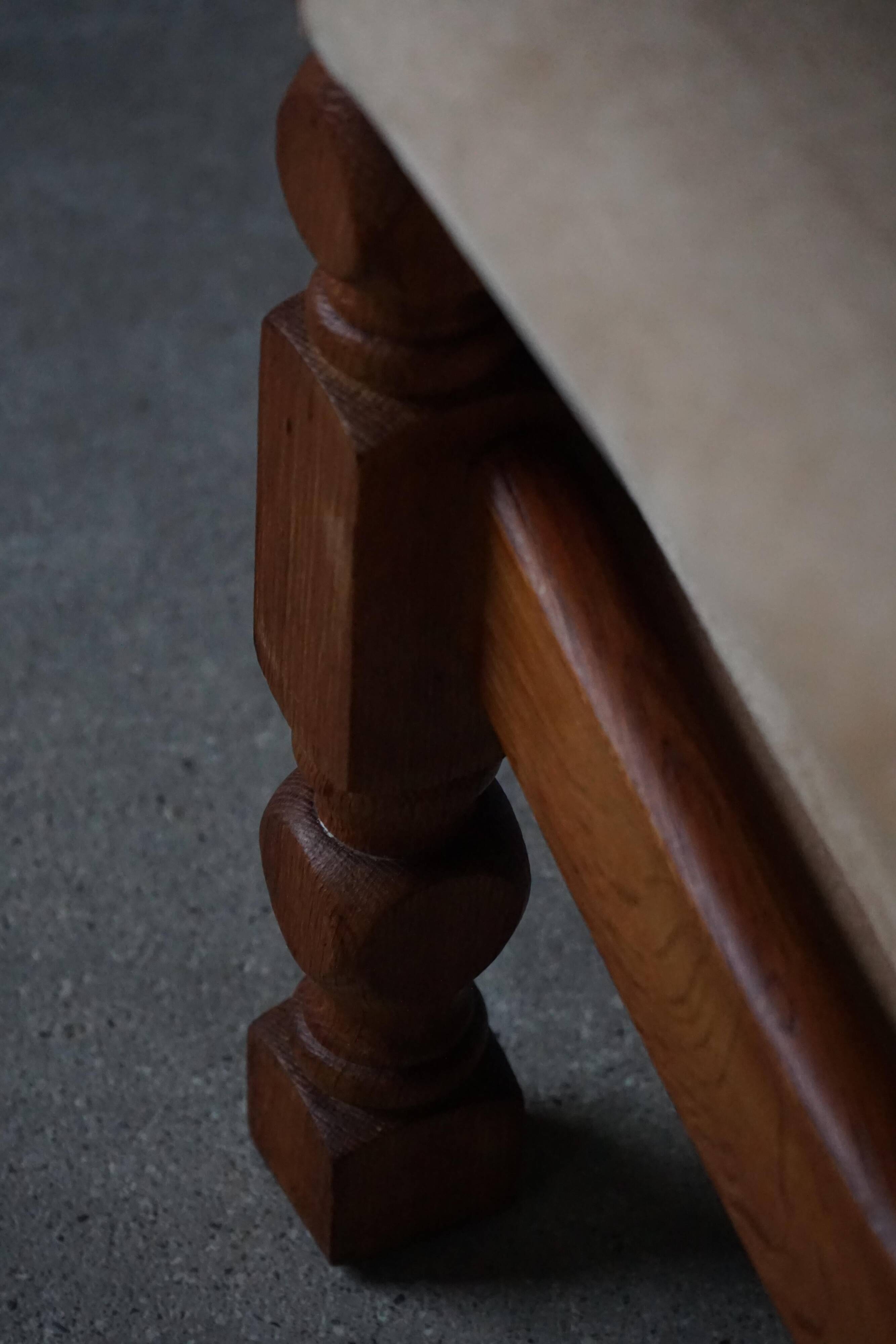 Mid-20th century, pair of armchairs by Henning Kjærnulf, oak and alcantara, 1960s.