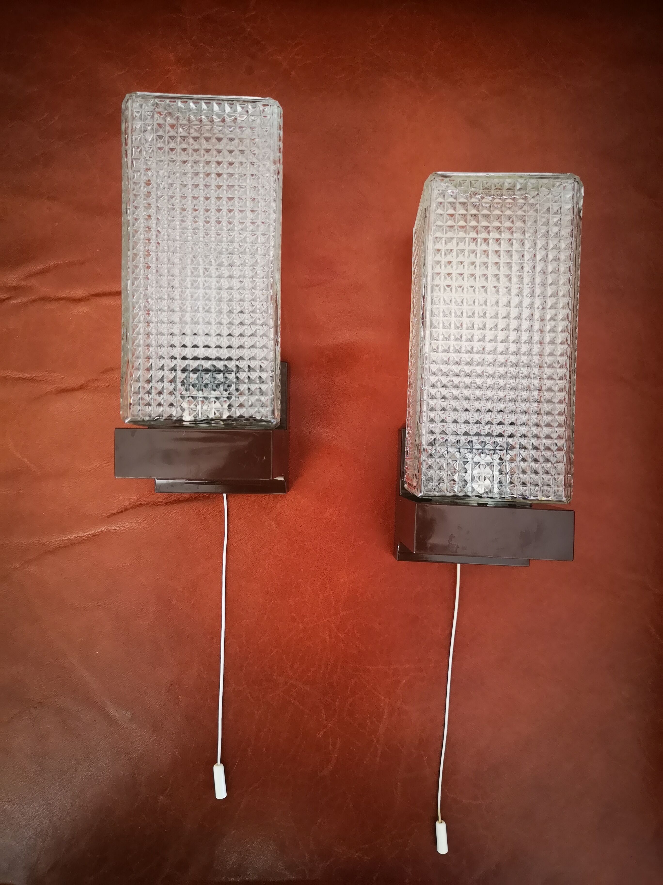 Pair of glass sconces, zipper, 70s