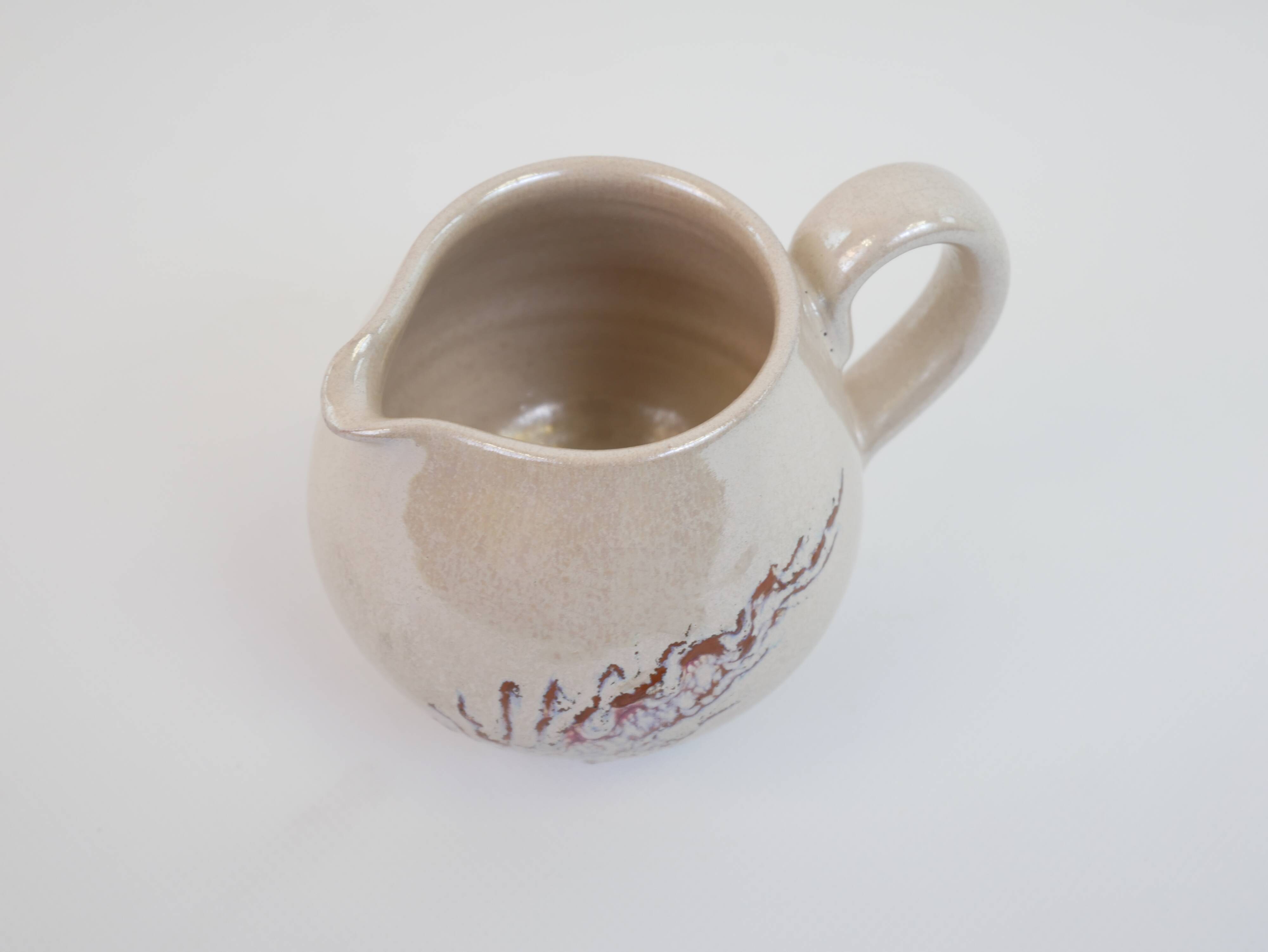 Pair of ceramic milk jugs signed La Roue Vallauris