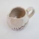 Pair of ceramic milk jugs signed La Roue Vallauris