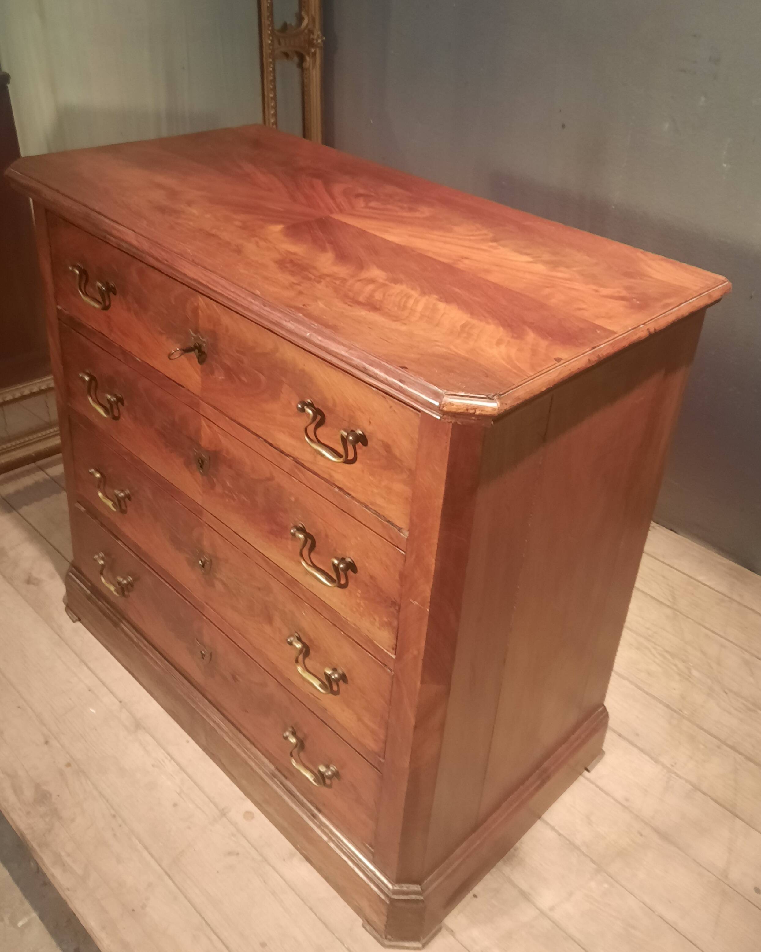 Small Louis Philippe chest of drawers with cut corners.