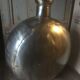 Pair of polished metal water flasks from Rajasthan.