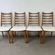 4 Scandinavian chairs, teak with boucle seats.