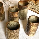 Series of five cups in sandstone