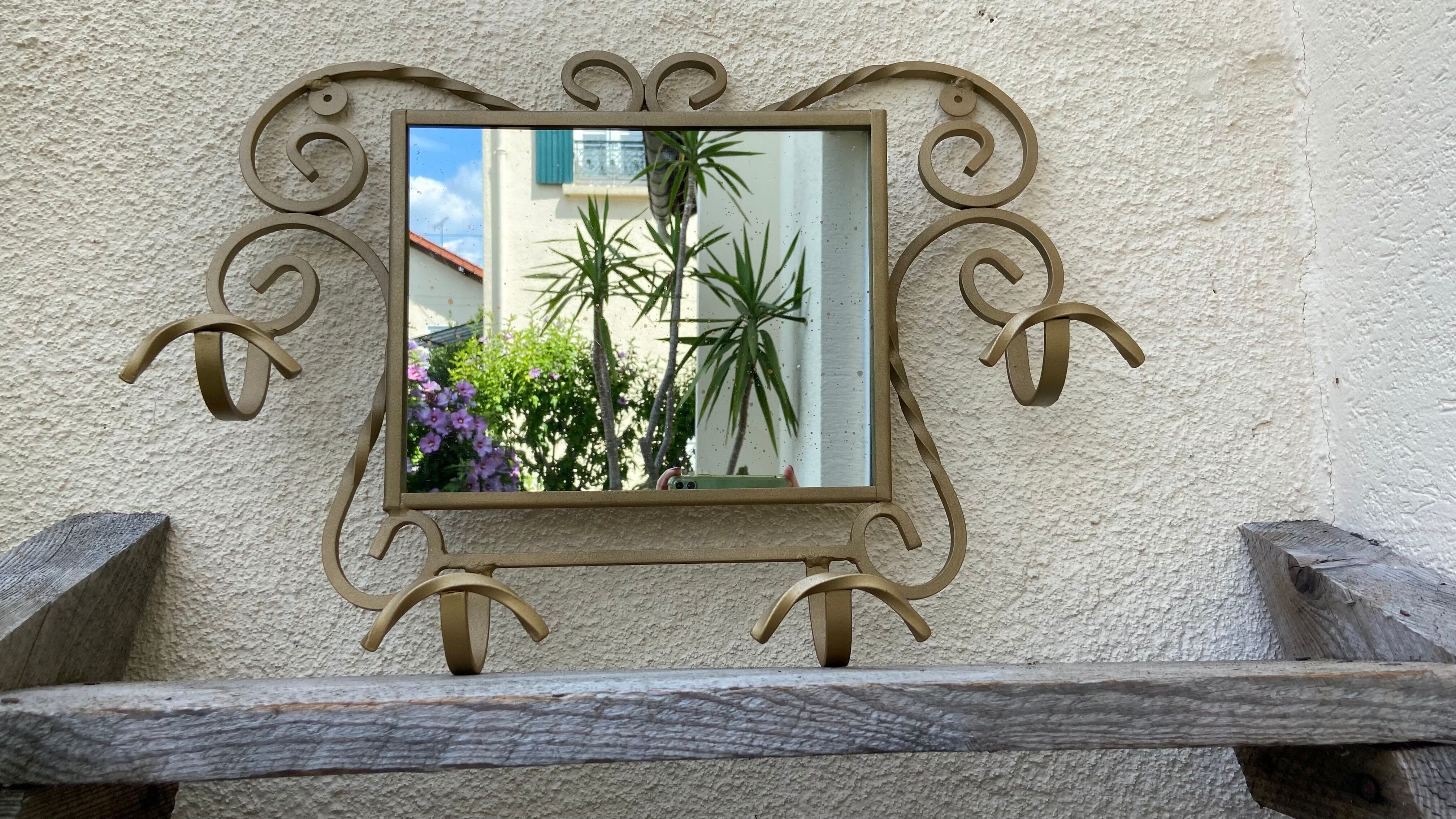 Wall-mounted gilded wrought iron coat rack with mirror