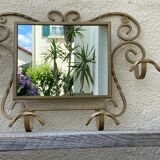 Wall-mounted gilded wrought iron coat rack with mirror