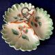 Beggar or servant in barbotine with fruit decoration heart handle