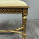 Antique gilded wooden bench in Louis XVI style, 19th century.