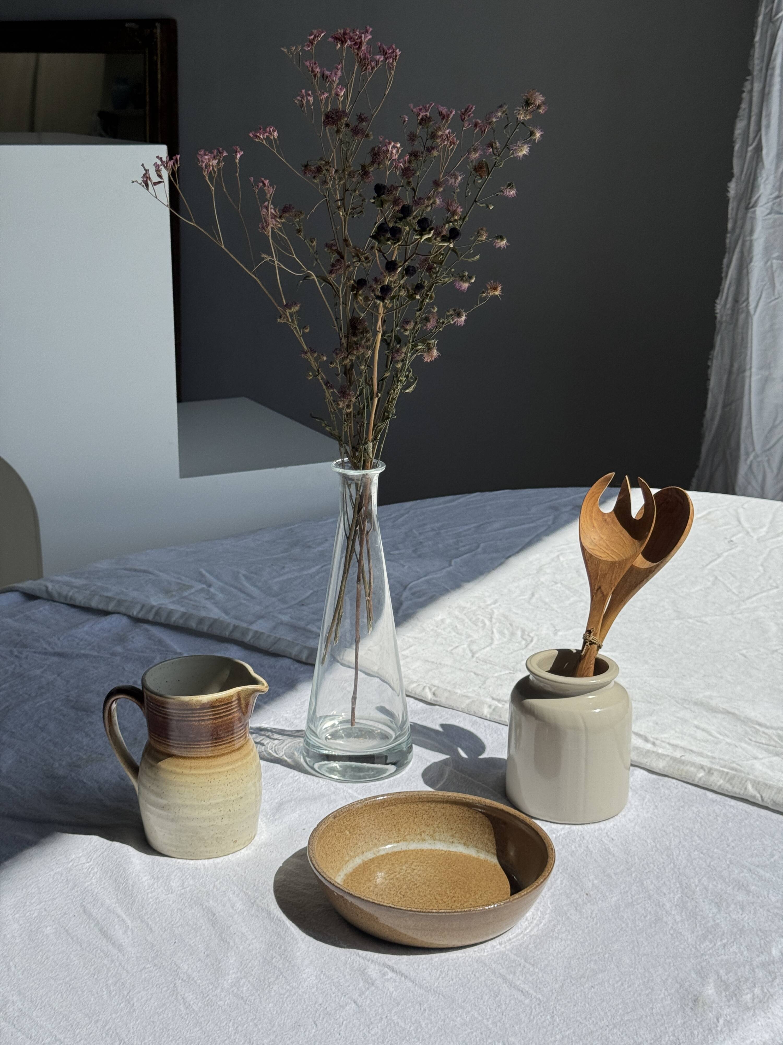A solid brown flat-bottomed stoneware bowl D18
