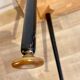Black glass coffee table wooden legs 60s