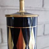 Vintage floor ashtray with a gold and black metal cigarette dispenser.