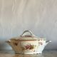 Antique porcelain soup bowl with floral decoration and golden border