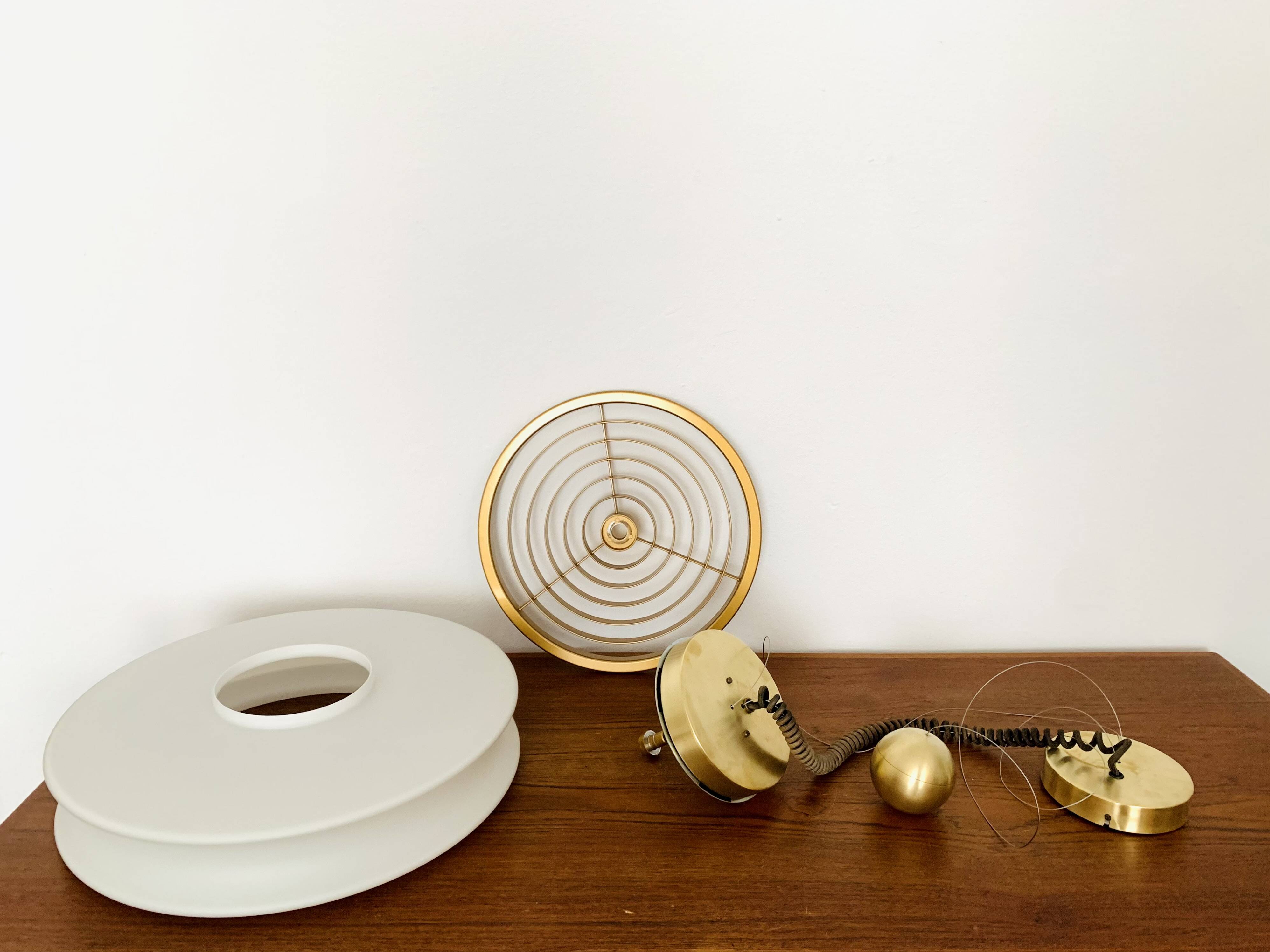 1 of 3 Awesome Adjustable Orion Glass Pendant Lamps from Staff