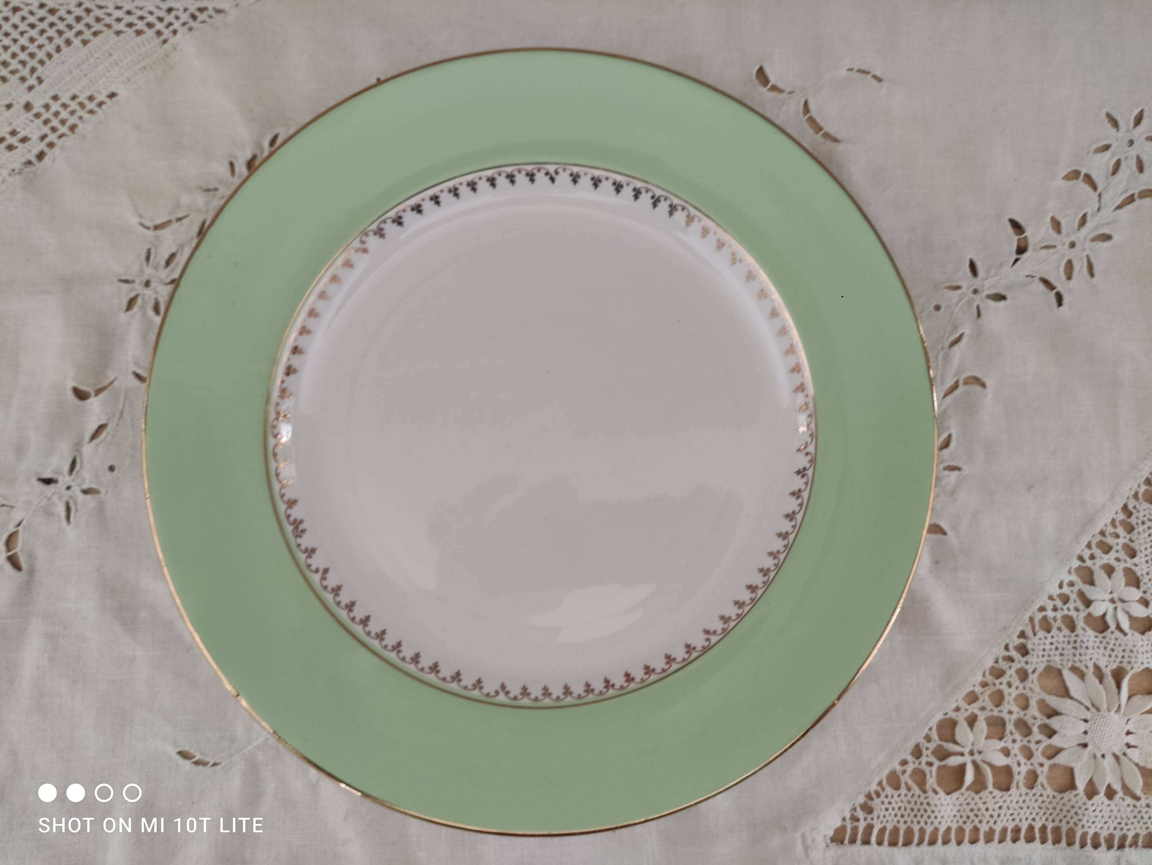 Round plate with aqua green rim and golden frieze, Cafés Lemaire.